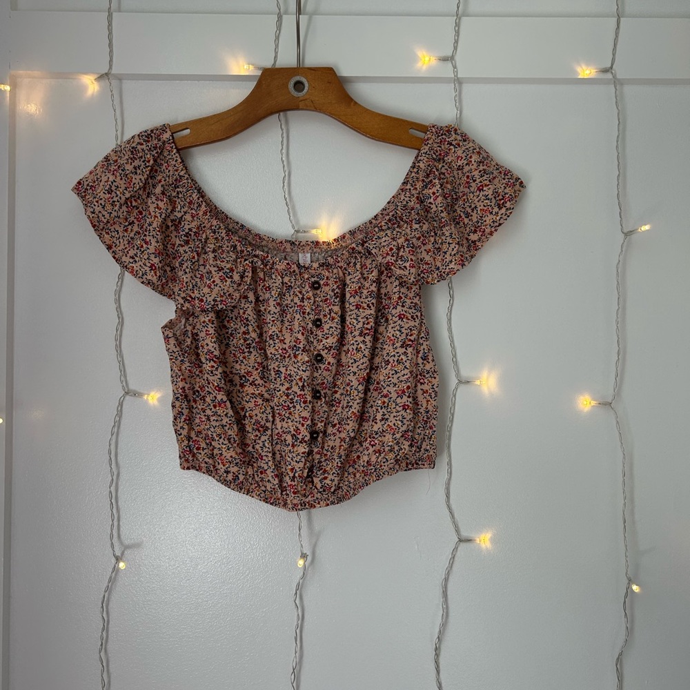 Pink floral top with blue, yellow and darker pink flowers